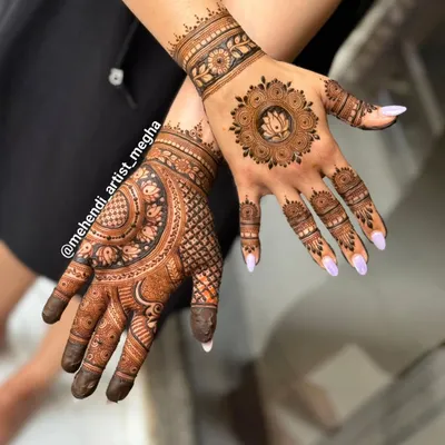 A beautiful example of a mixed-style design. One hand features a modern lotus mandala, while the other has a more traditional, dense pattern, showing how you can play with different looks.