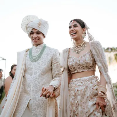 The happiest walk down the aisle. This bride chose a stunning ivory and gold lehenga, and I created a fresh, sun-kissed makeup look to match the outdoor daytime ceremony.