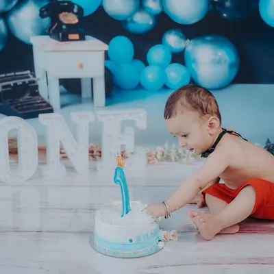 The first taste of birthday cake. This little one is getting right into the spirit of his cake smash session, a fun and memorable way to celebrate turning one.