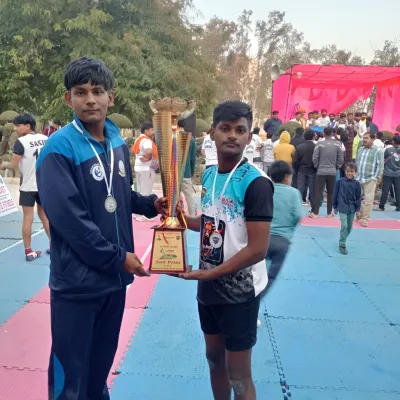 Our players holding the trophy after a successful tournament. This is the moment that makes all the sweat and hard work worth it.