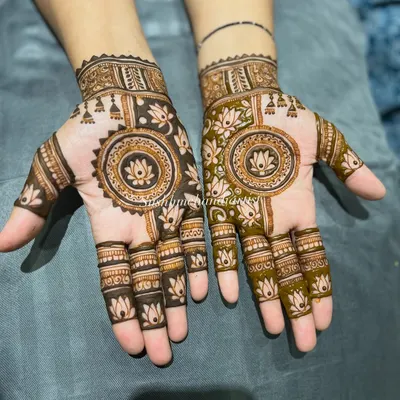 A beautiful mandala design with a lotus in the center. The pattern on each hand is slightly different, creating a unique look.