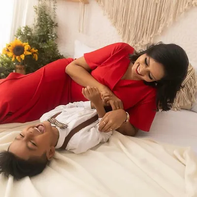 Capturing pure, uninhibited laughter is my favorite. This candid moment between a mother and her son during a lifestyle maternity session is filled with so much love and happiness.