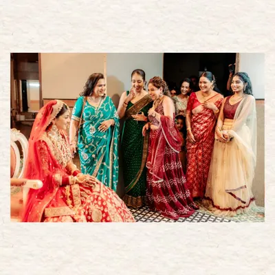 The bride sharing a moment of pure, uninhibited laughter with the women in her family. These are the candid, heartfelt moments that truly feel like home.
