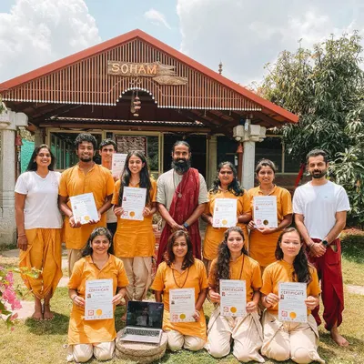 Our graduating class proudly displays their certificates in front of the Soham building. This is the culmination of a month of intense practice, study, and personal growth. Congratulations to our new yoga teachers!