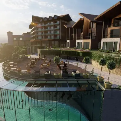 A render of an upcoming resort in Kufri, featuring an outdoor restaurant and a stunning glass-enclosed swimming pool. The design capitalizes on the location, offering guests mesmerizing views of the surrounding mountains.