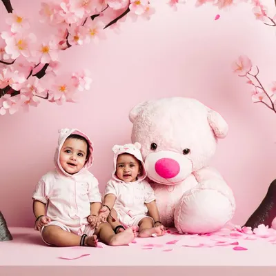 The 'after' shot showing our AI editing capabilities. We took the original studio photo and created a magical scene with cherry blossom trees and a soft pink environment, turning a simple portrait into a work of art.