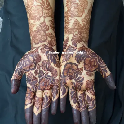 The stunning result of my natural henna after 48 hours. This bold floral design has developed into a deep, dark stain that covers the hands and forearms.