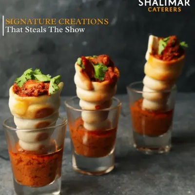 We create signature creations that steal the show. These chicken cones, served in shot glasses with a dipping sauce, are a perfect example of our creative and modern approach to appetizers.