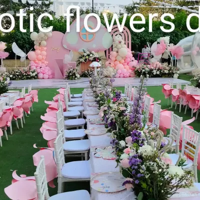 A magical, fairy-themed birthday party. We created a complete outdoor setup with a pink mushroom-themed stage, balloon arrangements, and long dining tables adorned with beautiful floral runners.