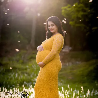 This mom-to-be wanted a golden hour shoot, and the results were pure magic. The mustard lace dress from our collection glows in the sunlight, and the natural pampas grass field provided the perfect bohemian backdrop.