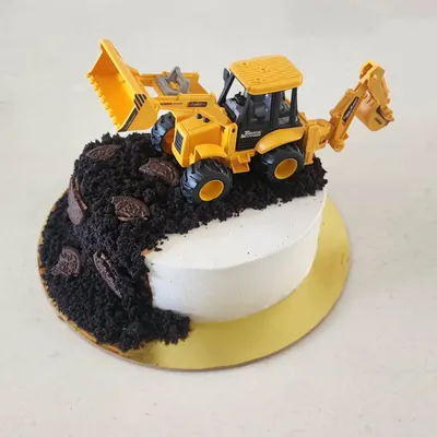 This adorable construction-themed cake was for a 3-year-old's birthday. It's a vanilla cake with dark chocolate ganache and fresh strawberries, with crushed Oreo cookies creating the "dirt" for the toy digger.