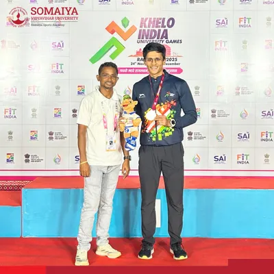 Jai Bhoir stands on the podium with his bronze medal won in the 100m sprint at the Khelo India University Games, a proud national-level achievement.