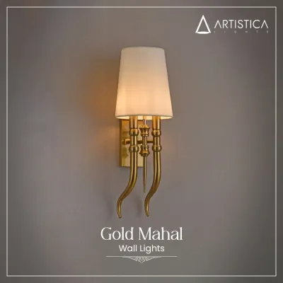 My 'Gold Mahal' wall light is designed to bring a royal touch to your interiors. It features gracefully curved arms in a gold finish and a classic fabric shade that provides a soft, warm illumination.