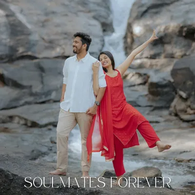 Soulmates forever, framed by the raw beauty of nature. A playful and joyful shot of the couple at a waterfall, capturing their fun-loving spirit.