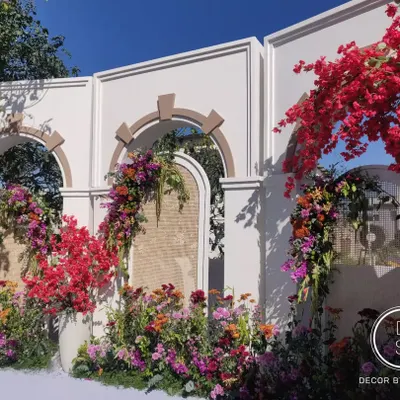 The full ceremony setup on the couple's home terrace. We used architectural arches and an explosion of colorful flowers, including their favorite bougainvillea, to create a stunning and personal mandap.