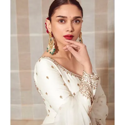 For the 'Taj: Divided By Blood' trailer launch, we went for a classic, regal look. This white anarkali by Jigar Mali with delicate gold embroidery, paired with stunning Golecha jewels and a bold red lip, was pure elegance.