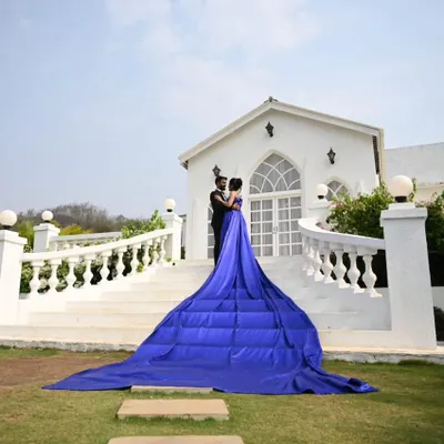 The definition of royal. This royal blue gown with its extra-long quilted trail creates a grand and majestic statement, perfect for a pre-wedding shoot at a palace or stately home.