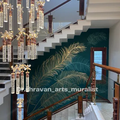 This gold foil feather design on a deep teal wall is one of my most popular styles. The way it sweeps up the staircase next to the grand chandelier creates a truly breathtaking and viral-worthy look.