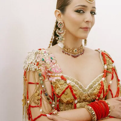For bride Shweta Kapur's Mehendi, I created a look that was both traditional and avant-garde. The sharp, winged eyeliner and flawless skin provided a modern contrast to her intricate heritage-inspired outfit and jewelry.