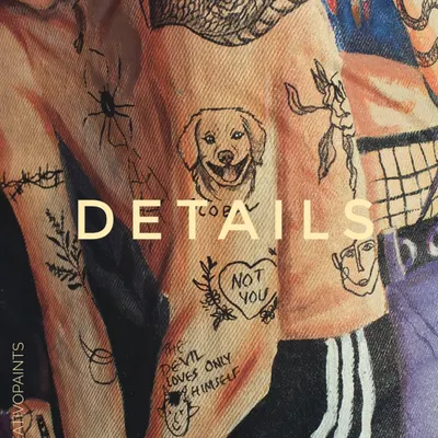 It's all in the details. A close-up of a custom hand-painted jacket, showing the intricate line work of the illustrated tattoos and designs.