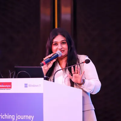 A close-up shot while presenting at an event for Microsoft India. I focus on delivering key messages with clarity and confidence.
