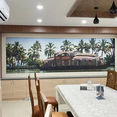 I brought the beauty of the Kerala backwaters into this dining room with a custom scenic mural. The image of a traditional houseboat creates a peaceful and culturally rich atmosphere for family meals.