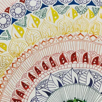 This vibrant mandala is a perfect example of how repeating patterns can create a stunning piece of art. My student used fine-tipped pens to draw the detailed layers, showing great patience and creativity.