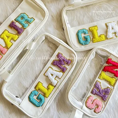 There’s no such thing as too many organizers, especially when they’re this pretty. These clear pouches are personalized with sparkling, colorful chenille letter patches spelling out "GLAM," "SKIN," and "HAIR."