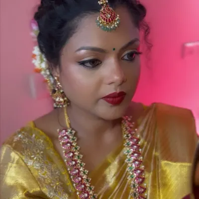 The final look on my beautiful client Swati. Here you can see the flawless base, sharp winged liner, and bold red lip, all coming together for a stunning traditional look.