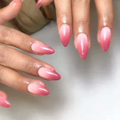 A perfect pink ombré on almond-shaped nails. This classic "baby boomer" style is a soft and elegant choice that's always beautiful.