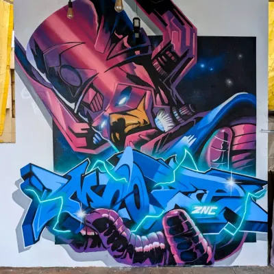 My finished Galactus mural, a piece that combines my love for comic book villains and graffiti art. This was painted on a huge canvas, using spray paint to get those cosmic blends and sharp letter effects.