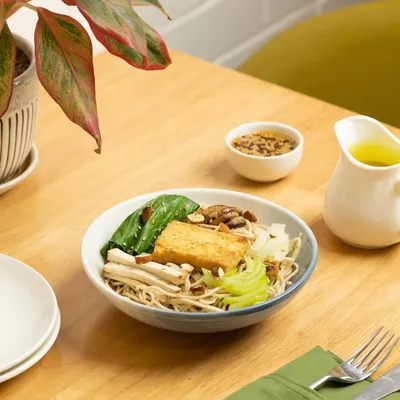 A close-up of a delicious noodle bowl, styled to look warm and inviting. We focus on textures, colors, and composition to make food look as good as it tastes.