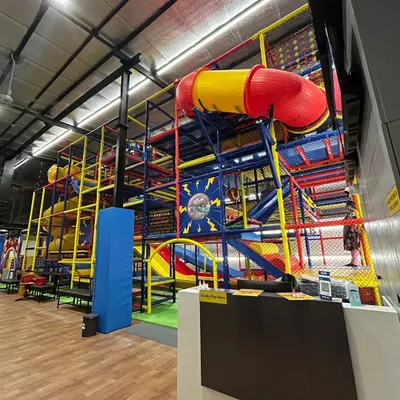 This is the heart of our play zone, a massive, multi-level structure filled with tunnels, obstacles, and slides. It’s a world of adventure designed to spark curiosity and active play.