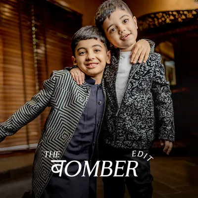 The Bomber Edit. These brothers showcase two of our unique bomber jackets, one with a modern geometric pattern and the other with a classic print, perfect for adding a stylish layer to any outfit.