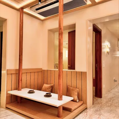 A closer look at the suspended dining bench, a feature I designed to be both functional and artistic. The solid wood posts anchor the floating table, creating a unique focal point in this Zen-inspired home.