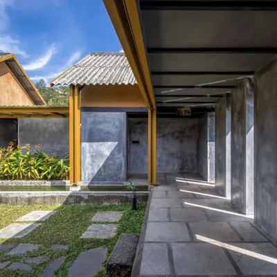 The exterior of Teyla restaurant uses locally sourced materials, including mud plaster and stone, to create a structure that feels native to the Idukki landscape. The design is both economically viable and contextually responsive.