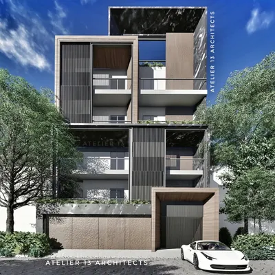 This contemporary facade design for an apartment building uses a palette of rich, dark materials. Vertical wooden louvers provide privacy and texture, contrasting with smooth stone panels and a prominent wood-clad entrance portal, creating a sophisticated and modern urban home.