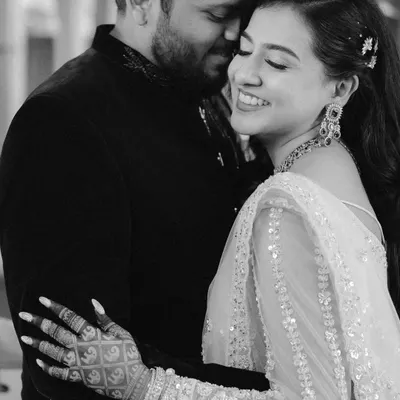 A moment of pure joy. This black and white close-up of Swati's laugh during her engagement captures an unscripted, beautiful emotion that color would only distract from.