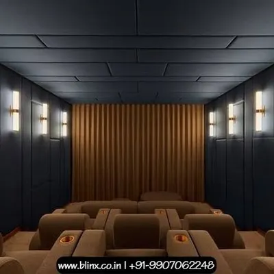 This design features a sophisticated and modern aesthetic with dark, paneled acoustic walls and a matching ceiling. The warm, vertical wall sconces provide soft, indirect lighting, creating an elegant and comfortable environment for enjoying films.