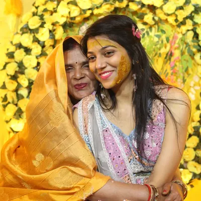 An emotional hug between the bride and her mother during the Haldi ceremony. These are the priceless, heartfelt moments we strive to preserve for you through our candid photography.