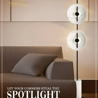 Let your corners steal the spotlight with this modern floor lamp. The two marble-effect discs provide a soft, ambient glow, making it a statement piece for any living room.
