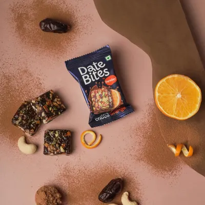 A fresh and vibrant flatlay for Date Bites. I used the product's ingredients like orange, cashews, and dates to tell a story about its flavor and natural goodness.