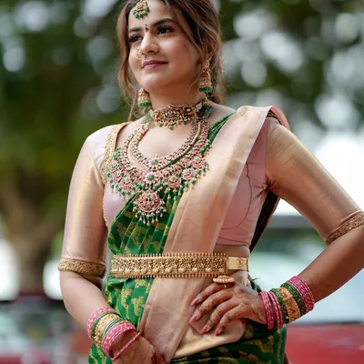 One of my cutest clients looking absolutely lovely in a green and pink saree, paired with a grand layered kempu stone necklace set.