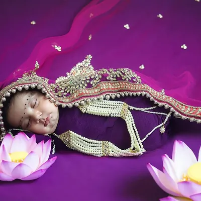 A divine newborn portrait for Navratri. I styled this sleeping baby as a little goddess, using rich colours, traditional jewelry, and symbolic lotus flowers to create a truly special image.