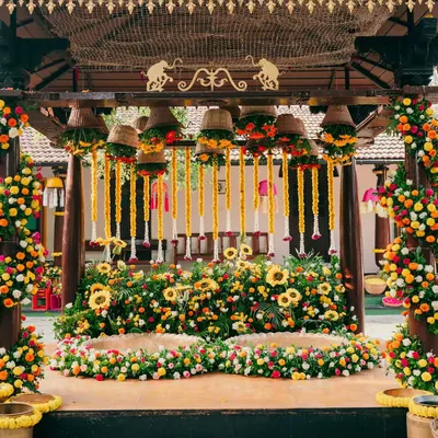 A spectacular Haldi stage overflowing with sunflowers and marigolds. We use an abundance of fresh, bright flowers to create a joyful and photogenic setting for this fun-filled ceremony.