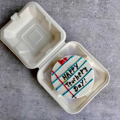 A creative bento cake for Teacher's Day, designed to look like a ruled notebook page. It's a sweet and thoughtful way to say thank you to a mentor.