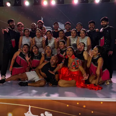 This is what it's all about. A massive, happy, and slightly crazy group photo with our dance family after a show. The energy and support are everything.