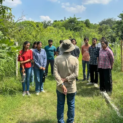 Here I am leading a group of curious students from Amity University into one of our Noida plantation sites. My goal is to make them pause, listen, and see the forest as a complete living system.