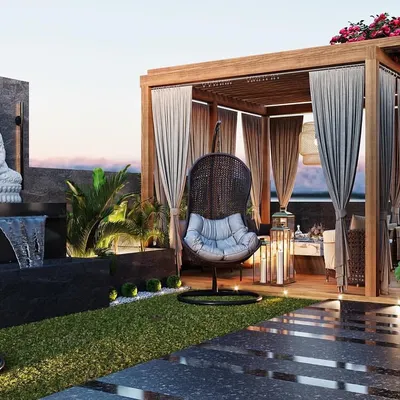 A luxurious terrace design featuring a wooden pergola with curtains for privacy, a tranquil Buddha statue with a water feature, and comfortable seating. This render sells an aspirational lifestyle.
