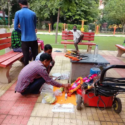 Performing the Vishwakarma pooja for our lawnmower and other tools. This annual ritual is important to us and shows our respect for the equipment that helps us make the world greener.